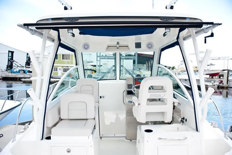 Slide: The Image of Manufacturer Provided Image: 2019 Boston Whaler 285 Conquest boat interior at a marina. - 12