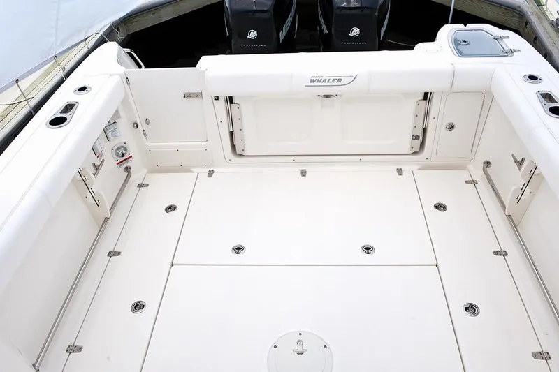 Slide: The Image of Manufacturer Provided Image: 2019 Boston Whaler 285 Conquest boat deck with storage compartments and seating. - 14