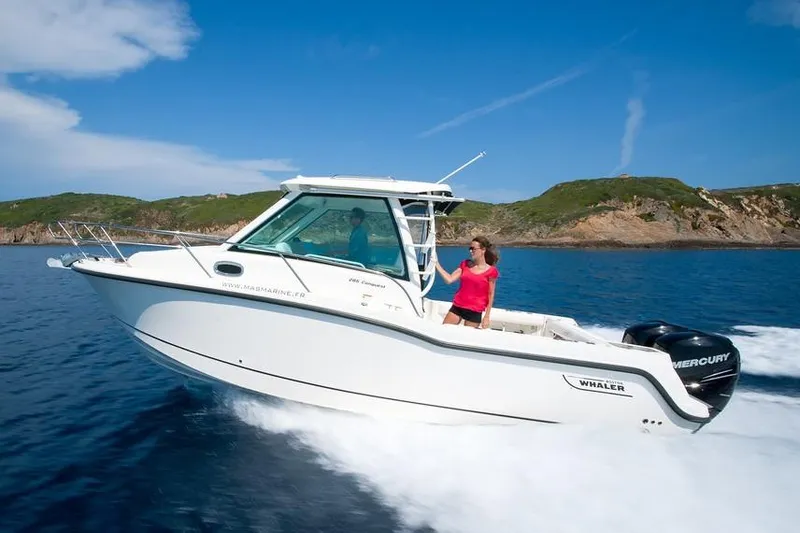 Slide: The Image of Manufacturer Provided Image: 2019 Boston Whaler 285 Conquest cruising on open water. - 2