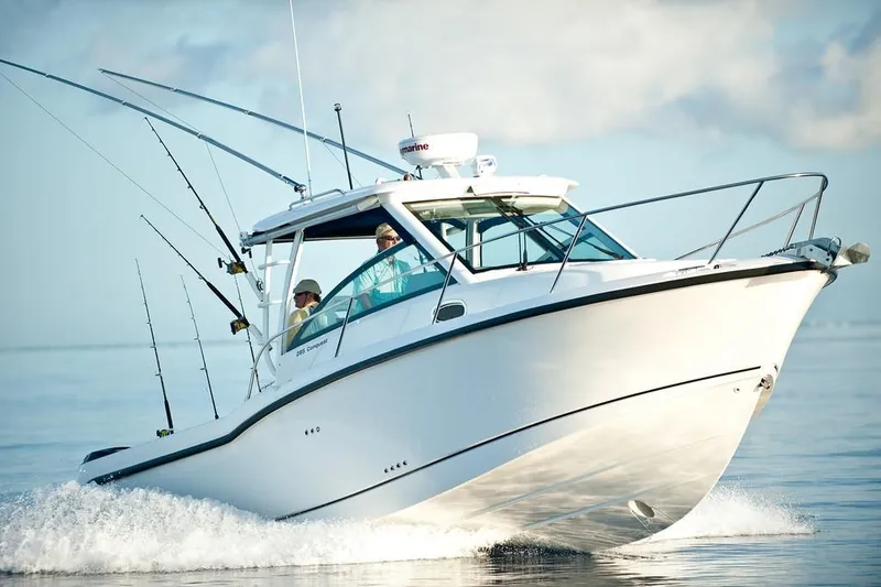 Slide: The Image of Manufacturer Provided Image: 2019 Boston Whaler 285 Conquest boat cruising on water. - 3