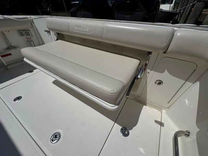 Slide: The Image of 2019 Boston Whaler 285 Conquest boat seat and storage compartment. - 30