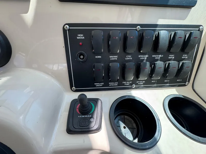 Slide: The Image of Control panel of a 2019 Boston Whaler 285 Conquest boat with switches and joystick. - 36