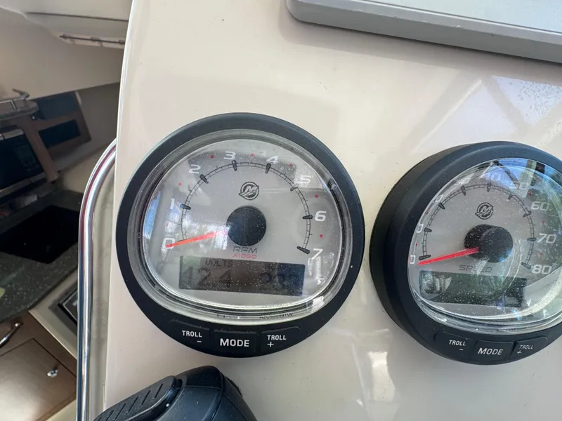 Slide: The Image of Dashboard gauges of a 2019 Boston Whaler 285 Conquest boat. - 38