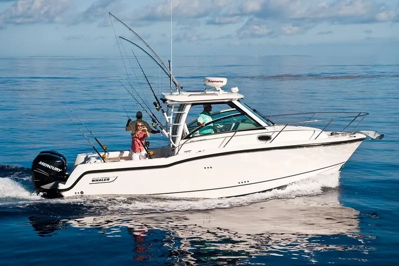 Slide: The Image of Manufacturer Provided Image: 2019 Boston Whaler 285 Conquest boat cruising on calm ocean waters. - 5