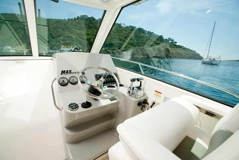 Slide: The Image of Manufacturer Provided Image: 2019 Boston Whaler 285 Conquest helm station with scenic water view. - 8