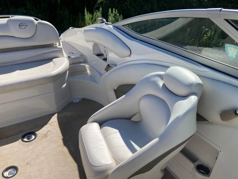 Slide: The Image of 2007 Crownline 260 LS boat interior with white leather seating and sleek design. - 10