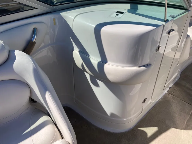 Slide: The Image of 2007 Crownline 260 LS boat interior with white seating and sleek design. - 12