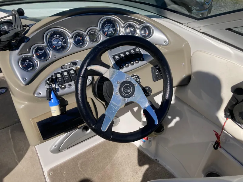Slide: The Image of 2007 Crownline 260 LS boat dashboard with steering wheel and instrument panel. - 17