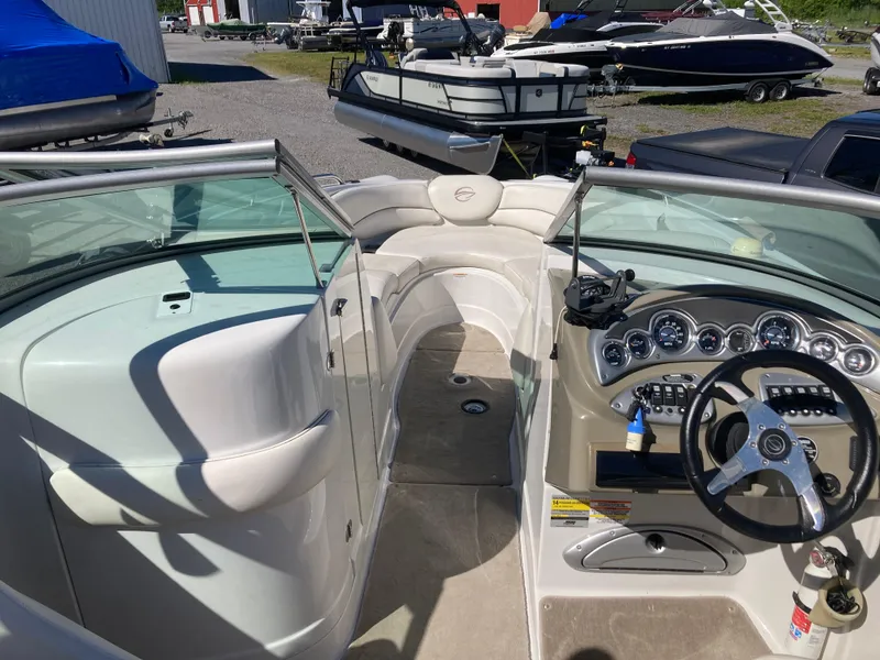 Slide: The Image of 2007 Crownline 260 LS boat interior with steering wheel and dashboard controls. - 18