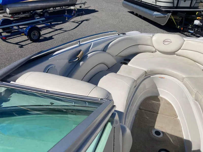 Slide: The Image of 2007 Crownline 260 LS boat interior with white seating and open deck area. - 20