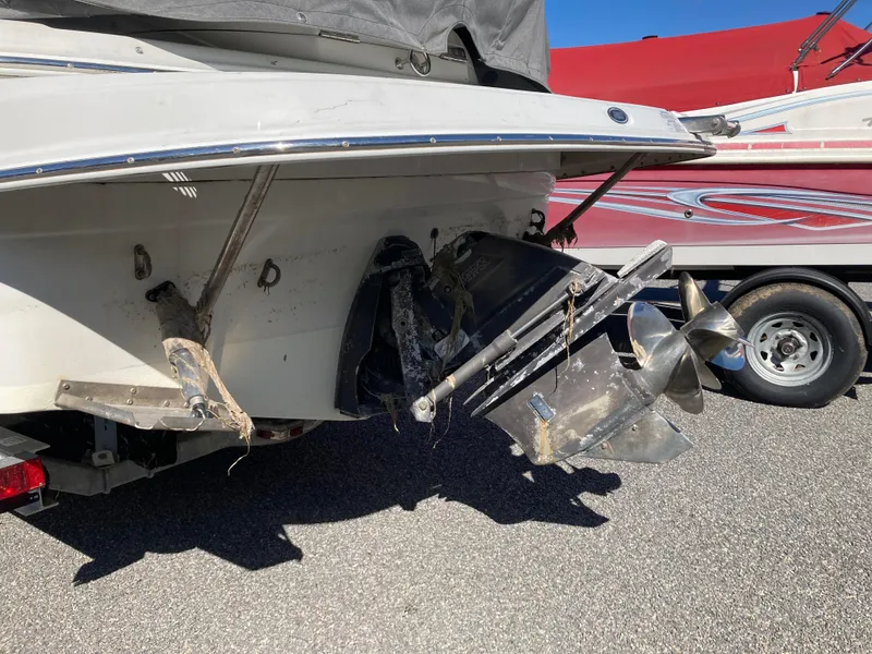 Slide: The Image of 2007 Crownline 260 LS boat with visible propeller and stern drive on a trailer. - 4