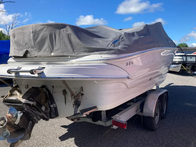 Slide: The Image of 2007 Crownline 260 LS boat on trailer, covered, under clear blue sky. - 5