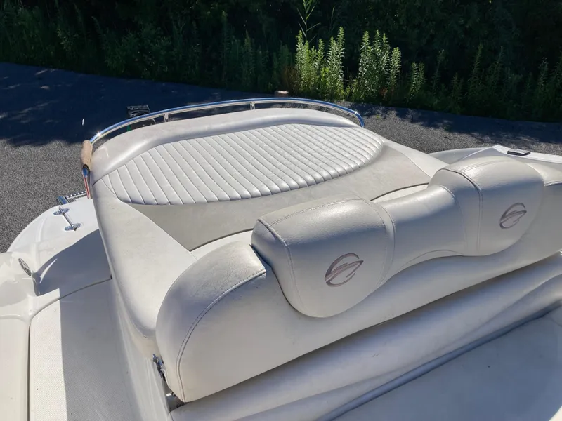 Slide: The Image of 2007 Crownline 260 LS boat with white leather seating and sleek design. - 7