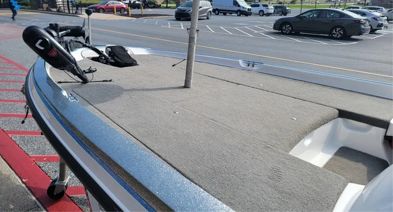 Slide: The Image of 2006 Nitro 482 DC boat parked in a lot, featuring a spacious deck. - 6