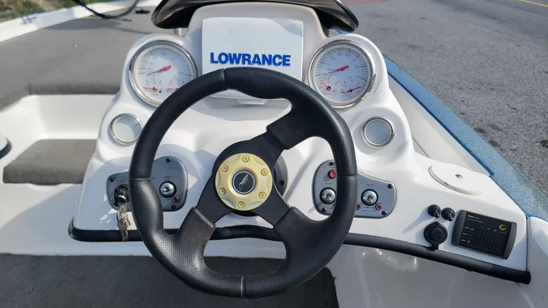 Slide: The Image of Steering console of a 2006 Nitro 482 DC boat with Lowrance electronics. - 9