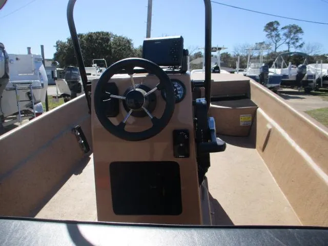 Slide: The Image of 2023 Rabco 16 Buccaneer boat interior with steering wheel and control panel. - 10