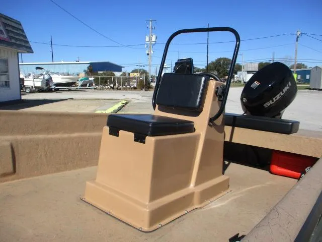 Slide: The Image of 2023 Rabco 16 Buccaneer boat with Suzuki motor, beige interior, and outdoor setting. - 6