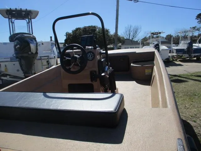 Slide: The Image of 2023 Rabco 16 Buccaneer boat interior with steering console and seating. - 9