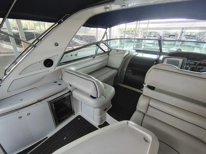 Slide: The Image of 1997 Bayliner 4085 Avanti interior with white seating and modern dashboard. - 1