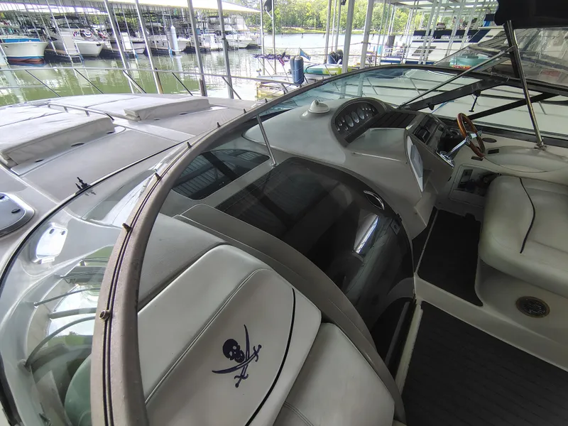 Slide: The Image of 1997 Bayliner 4085 Avanti boat interior with steering wheel and seating at marina. - 17