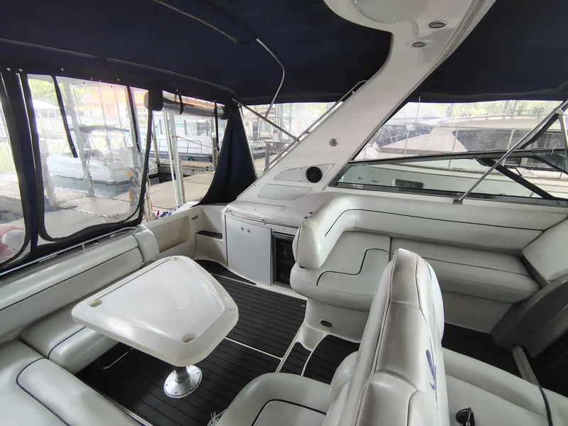 Slide: The Image of 1997 Bayliner 4085 Avanti yacht interior with white seating and table. - 20
