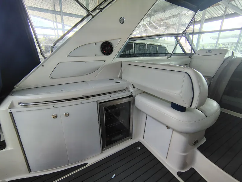 Slide: The Image of 1997 Bayliner 4085 Avanti interior with white seating and built-in storage. - 23