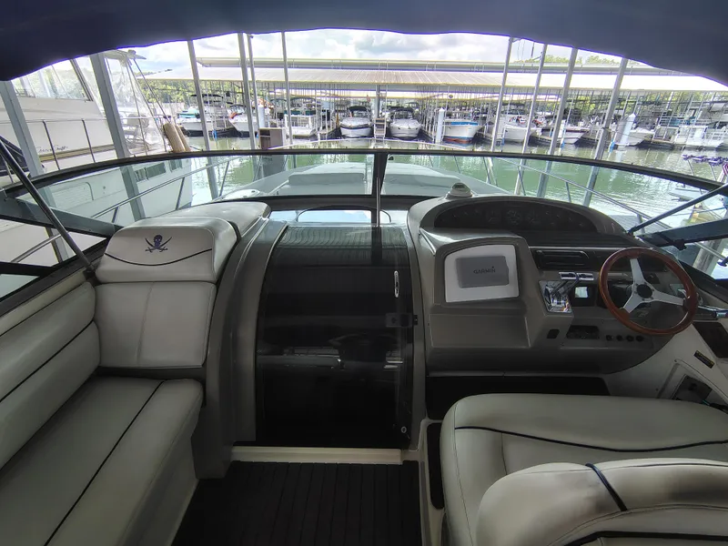 Slide: The Image of 1997 Bayliner 4085 Avanti yacht cockpit with leather seating and Garmin navigation system. - 24