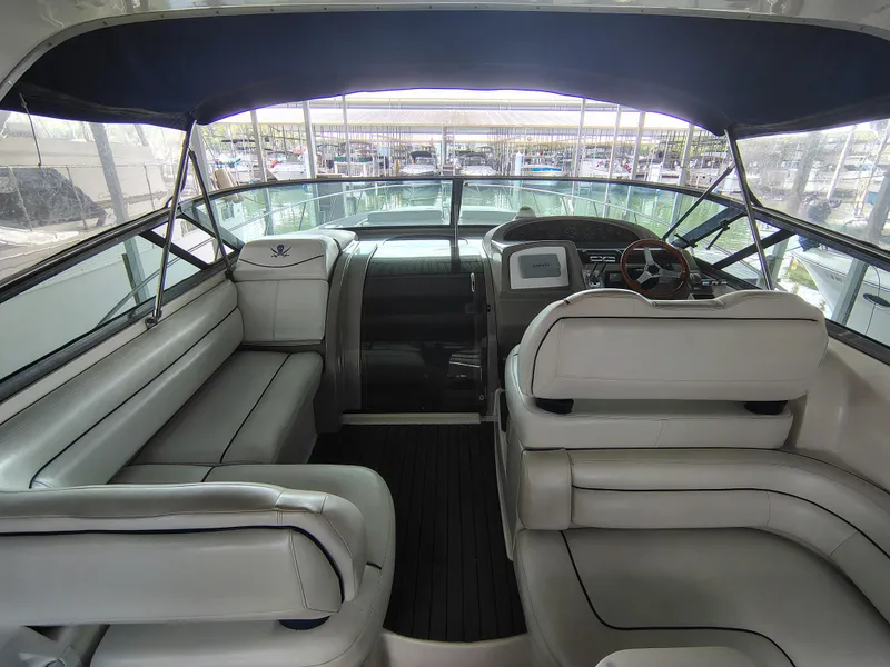 Slide: The Image of 1997 Bayliner 4085 Avanti yacht interior with leather seating and steering wheel. - 25