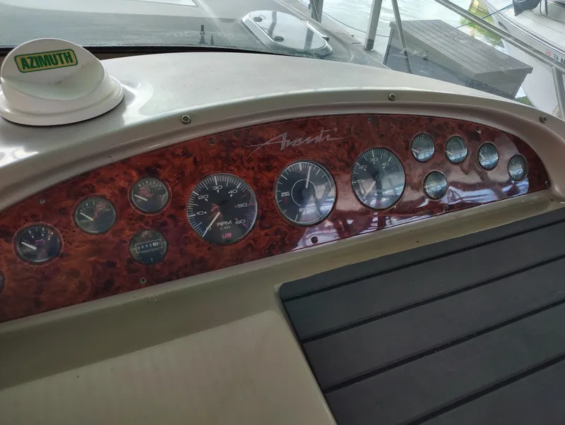 Slide: The Image of Dashboard of a 1997 Bayliner 4085 Avanti boat with gauges and Azimuth compass. - 28