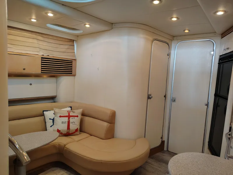 Slide: The Image of Interior of 1997 Bayliner 4085 Avanti yacht with beige seating and modern lighting. - 31