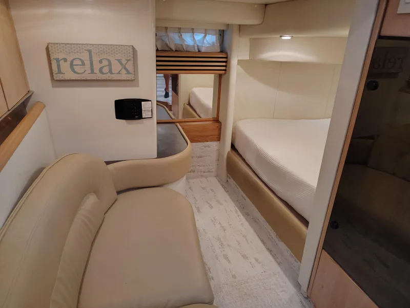 Slide: The Image of Interior of 1997 Bayliner 4085 Avanti yacht with cozy seating and bed. - 34