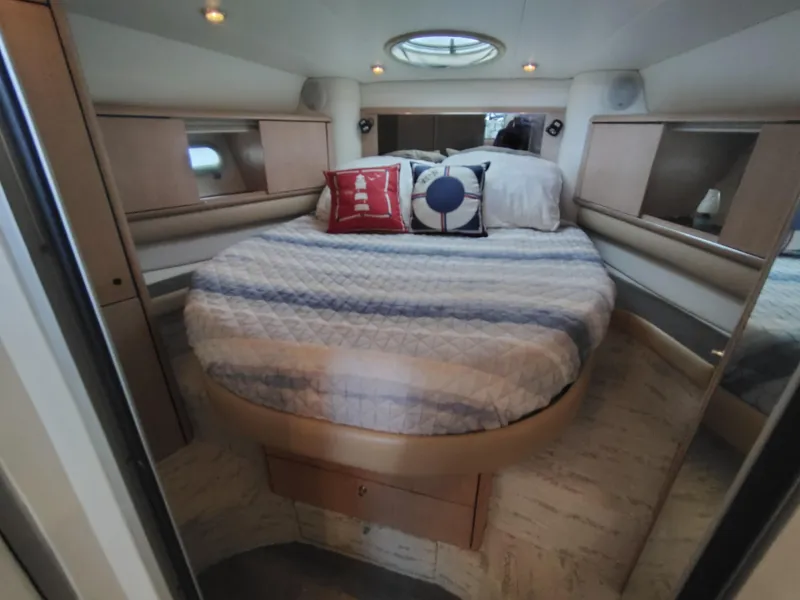 Slide: The Image of Luxurious cabin interior of 1997 Bayliner 4085 Avanti yacht with cozy bed and nautical decor. - 38