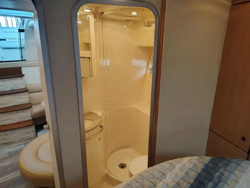 Slide: The Image of Interior of 1997 Bayliner 4085 Avanti yacht showing bathroom and seating area. - 41