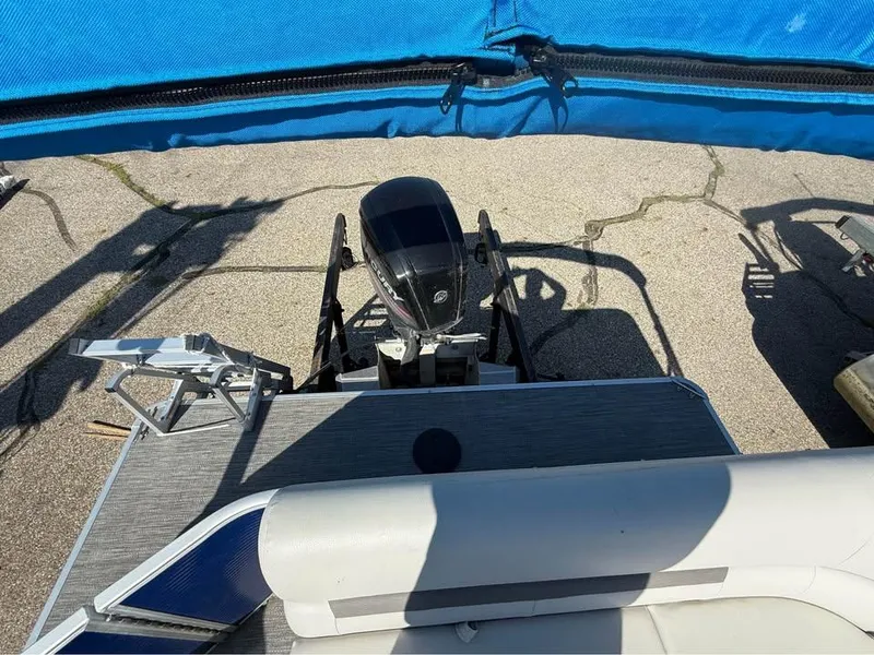 Slide: The Image of 2020 Godfrey Sweetwater 2086 CX boat with outboard motor and blue canopy. - 10