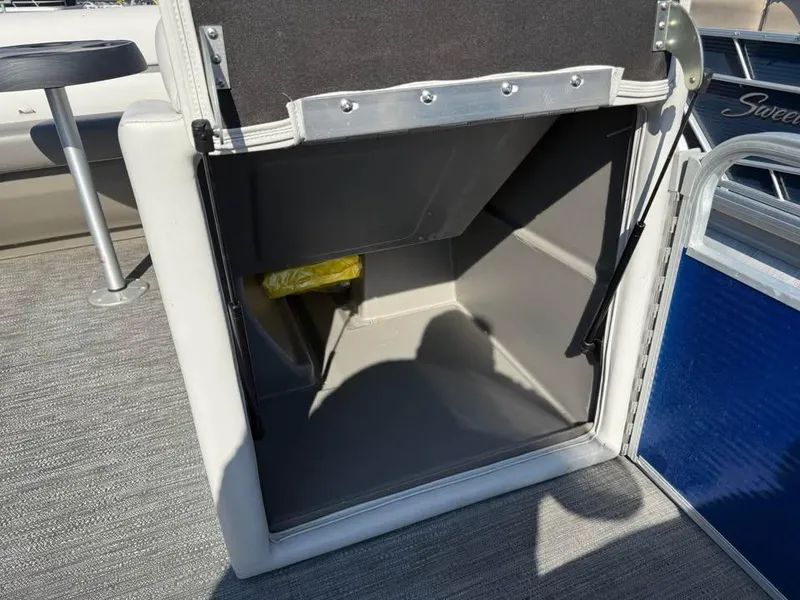 Slide: The Image of Open storage compartment on a 2020 Godfrey Sweetwater 2086 CX pontoon boat. - 11