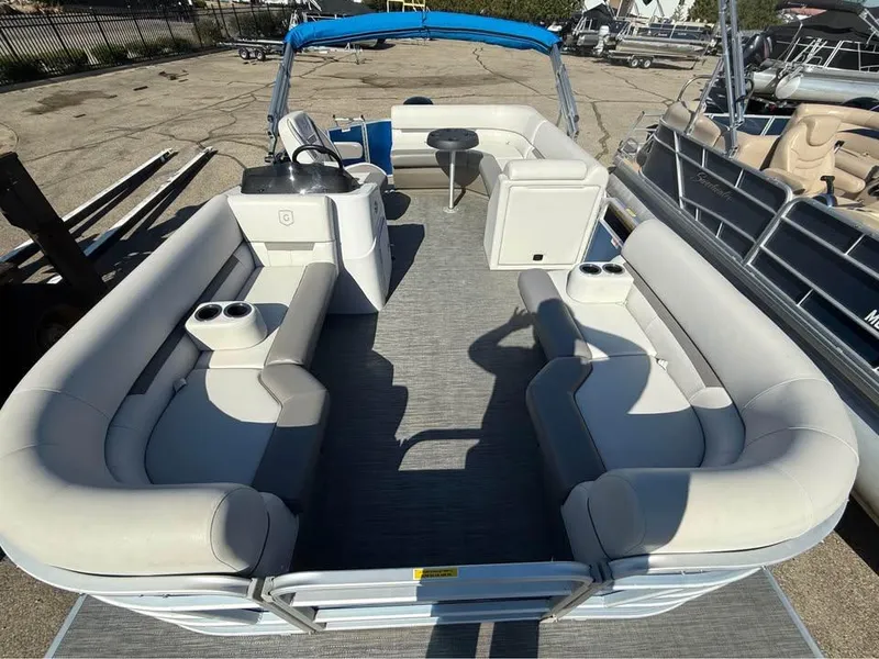 Slide: The Image of 2020 Godfrey Sweetwater 2086 CX pontoon boat with spacious seating and blue canopy. - 4