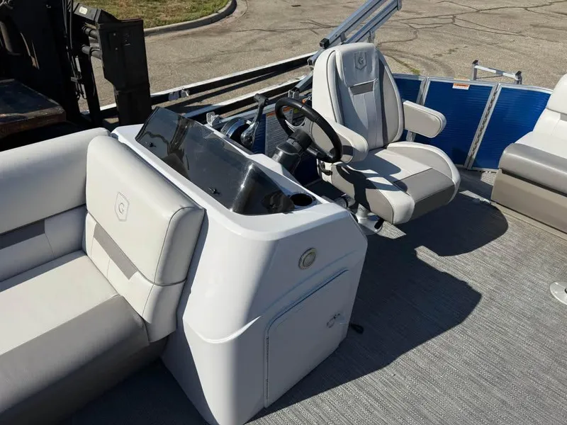 Slide: The Image of 2020 Godfrey Sweetwater 2086 CX boat interior with steering console and seating. - 7