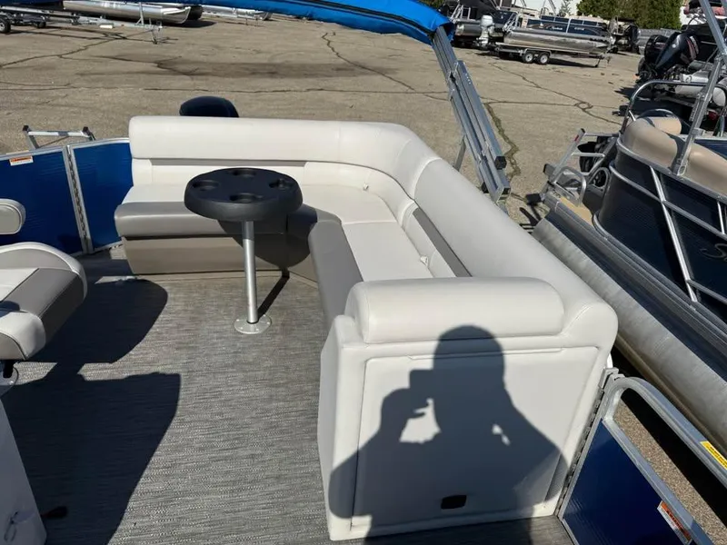 Slide: The Image of 2020 Godfrey Sweetwater 2086 CX pontoon boat interior with white seating and table. - 9