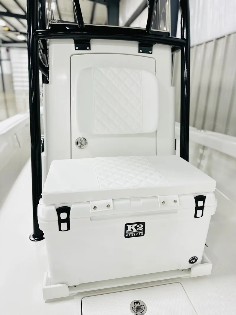 Slide: The Image of 2026 BlackJack 256 Coastal boat interior with K2 cooler and cushioned seating. - 13