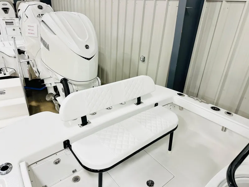 Slide: The Image of 2026 BlackJack 256 Coastal boat interior with Yamaha engine, featuring white seating and storage compartments. - 17