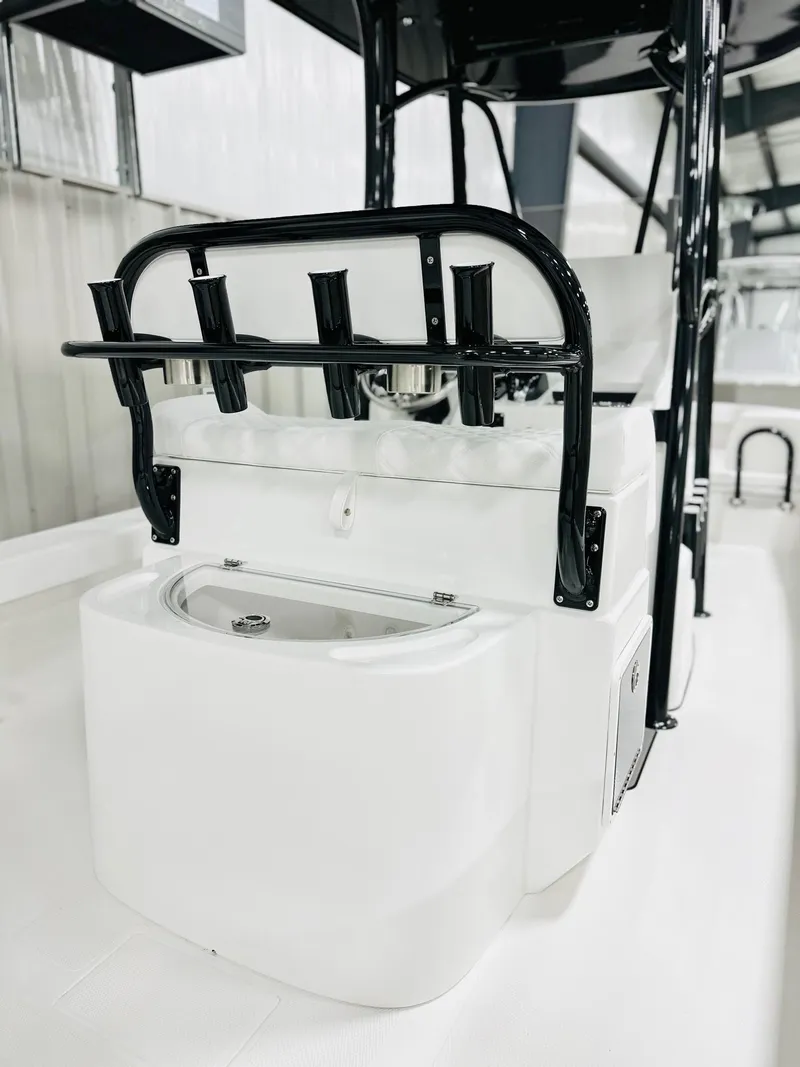 Slide: The Image of 2026 BlackJack Blackjack 256 Coastal boat interior with rod holders and storage compartment. - 5