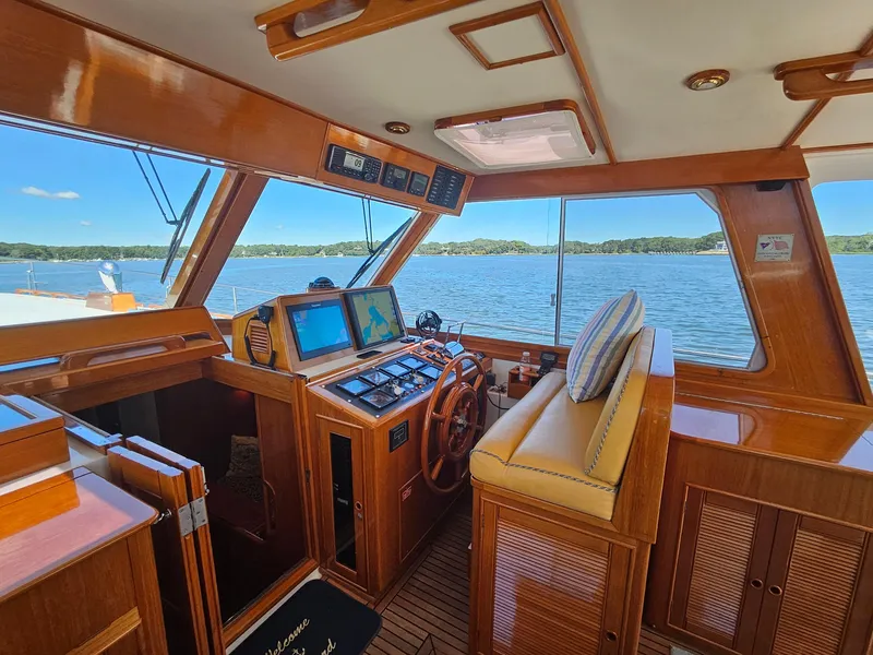 Slide: The Image of Interior of 2002 Grand Banks 49 Eastbay HX yacht with wooden helm and navigation screens. - 29