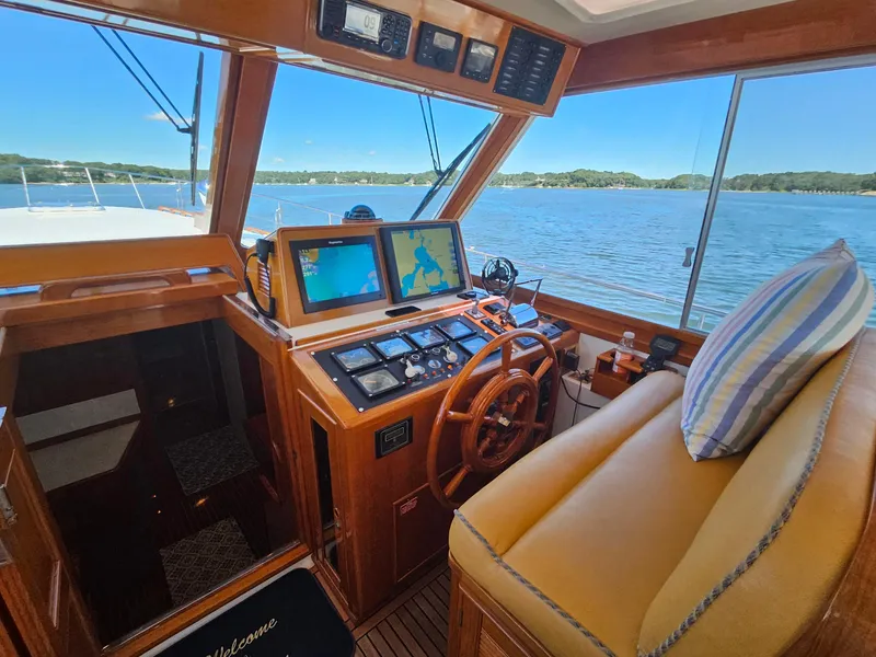 Slide: The Image of Interior of 2002 Grand Banks 49 Eastbay HX yacht with navigation equipment and scenic water view. - 30