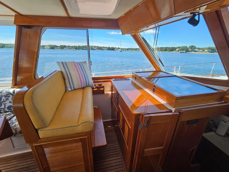 Slide: The Image of Interior of 2002 Grand Banks 49 Eastbay HX yacht with wooden finish and scenic water view. - 33