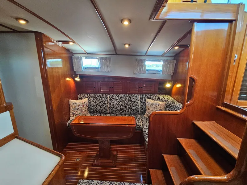 Slide: The Image of Luxurious 2002 Grand Banks 49 Eastbay HX yacht interior with elegant wood finish and cozy seating. - 37