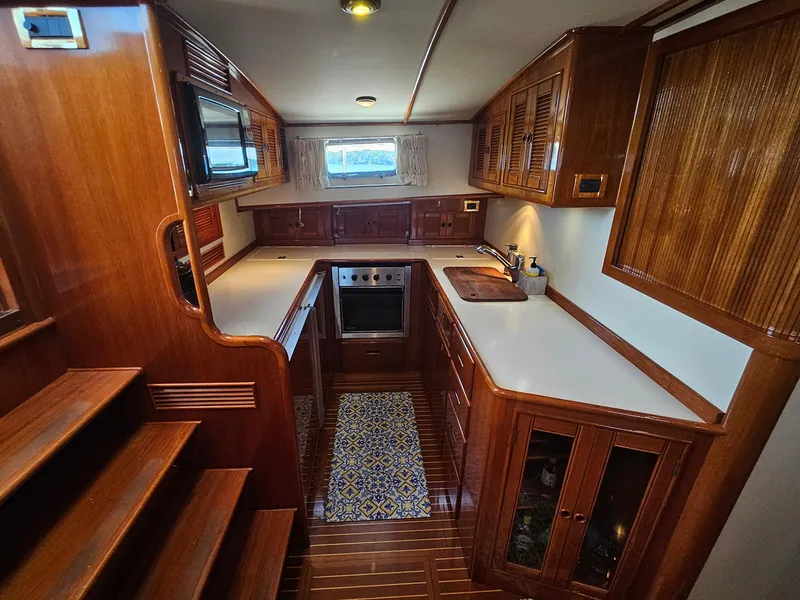 Slide: The Image of Luxurious wooden interior of 2002 Grand Banks 49 Eastbay HX yacht kitchen. - 38