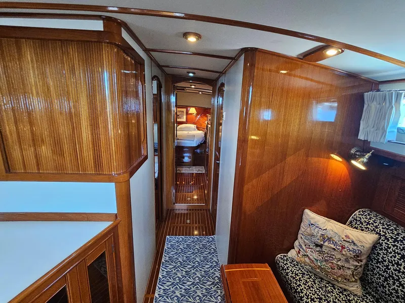 Slide: The Image of Luxurious 2002 Grand Banks 49 Eastbay HX yacht interior with polished wood and cozy seating. - 41