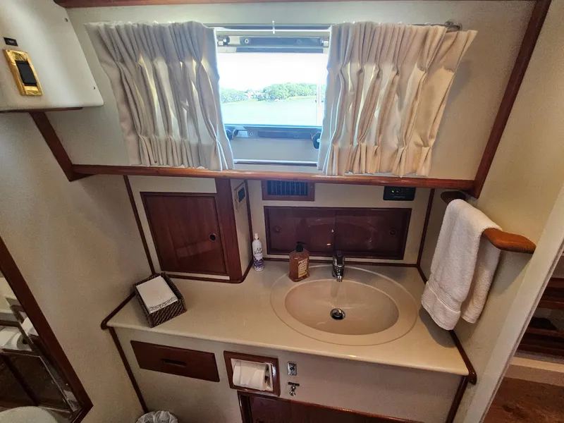 Slide: The Image of Bathroom interior of 2002 Grand Banks 49 Eastbay HX yacht with sink and window. - 44