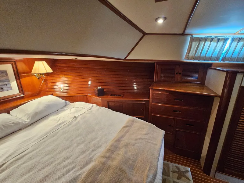Slide: The Image of Luxurious cabin interior of 2002 Grand Banks 49 Eastbay HX yacht with wooden furnishings. - 49
