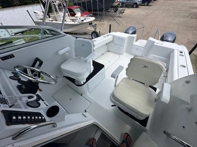 Slide: The Image of Interior view of a 2006 Glacier Bay 2240 SX Renegade boat with seating and controls. - 12